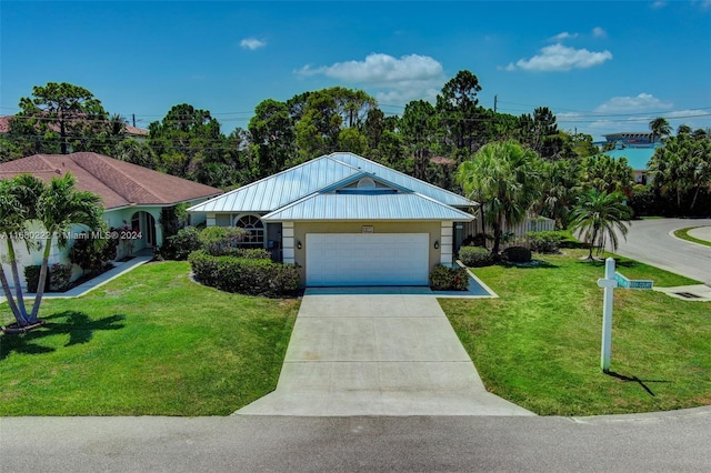 ranch-style house featuring a front lawn and a garage