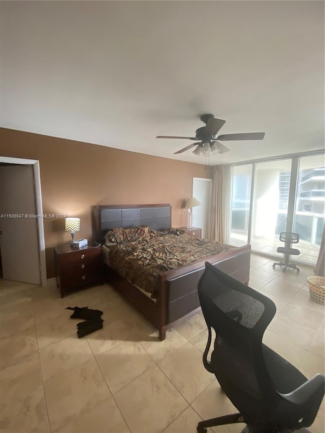 bedroom featuring ceiling fan and access to exterior