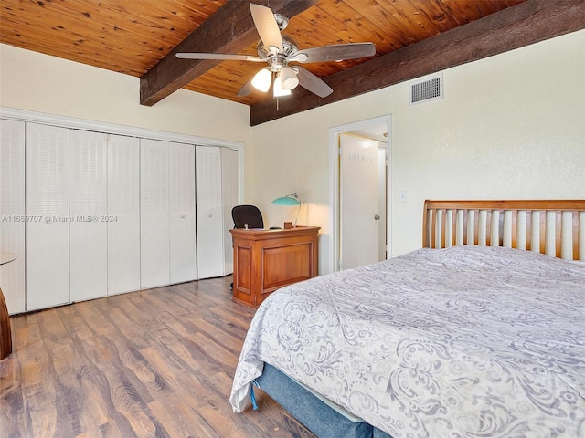 bedroom featuring wood ceiling, hardwood / wood-style floors, ceiling fan, beam ceiling, and a closet