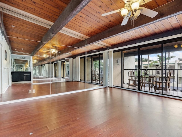 workout area with hardwood / wood-style flooring and wood ceiling