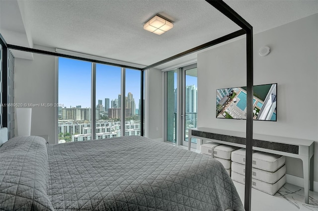330 Sunny Isles Blvd Unit 5-2207, Sunny Isles Beach, FL 33160 - bedroom featuring a textured ceiling, multiple windows, and floor to ceiling windows