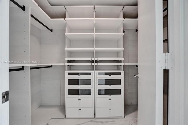 330 Sunny Isles Blvd Unit 5-2207, Sunny Isles Beach, FL 33160 - spacious closet featuring marble look tiles