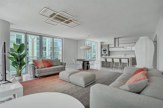 330 Sunny Isles Blvd Unit 5-2207, Sunny Isles Beach, FL 33160 - living area featuring a textured ceiling