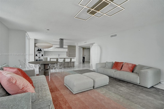 living room with a textured ceiling