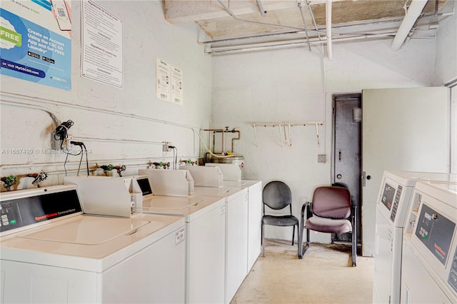 washroom featuring washing machine and dryer