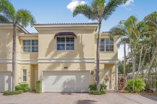 mediterranean / spanish-style home featuring a garage