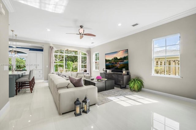 living room with ceiling fan and crown molding