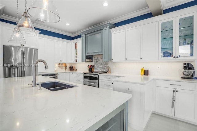 kitchen featuring white cabinetry, crown molding, pendant lighting, and stainless steel appliances