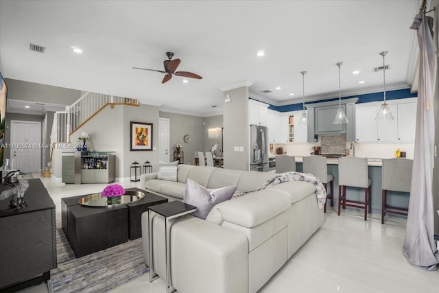 living room featuring sink, ceiling fan, ornamental molding, and light tile patterned flooring