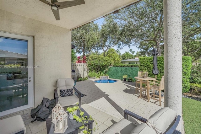 view of patio / terrace featuring ceiling fan and an outdoor living space