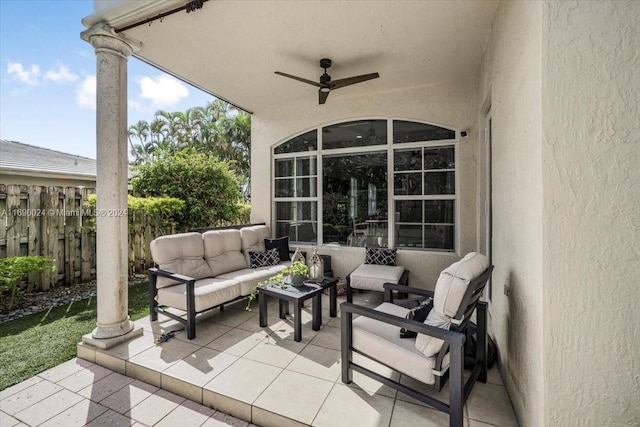 view of patio / terrace with ceiling fan and an outdoor living space