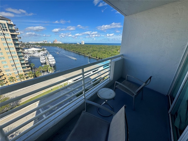 balcony featuring a water view