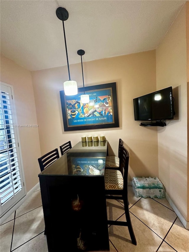 dining area with a textured ceiling