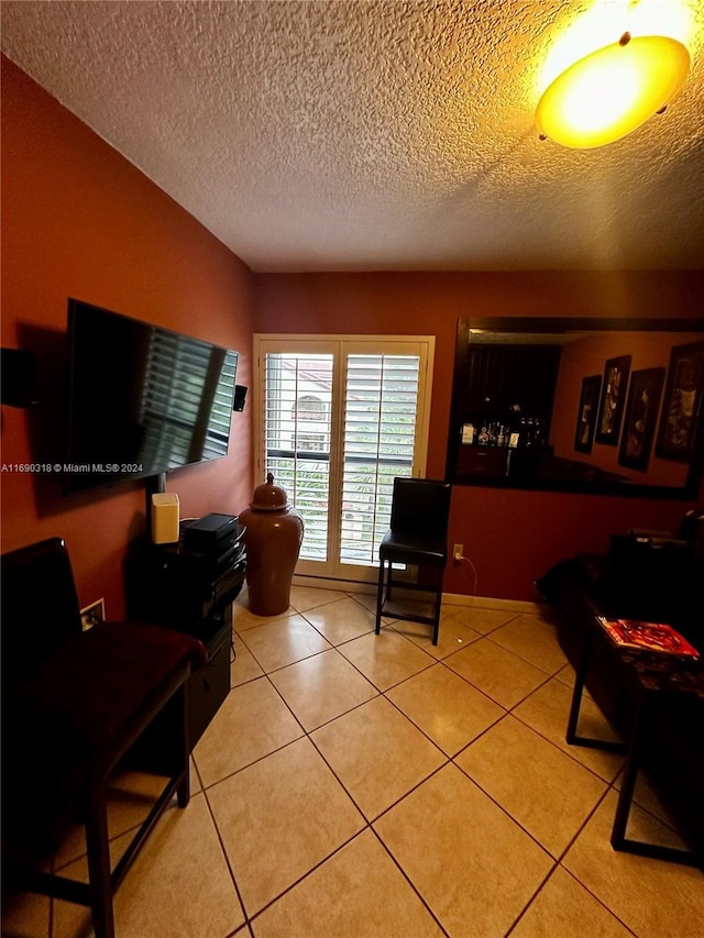 tiled living room with a textured ceiling