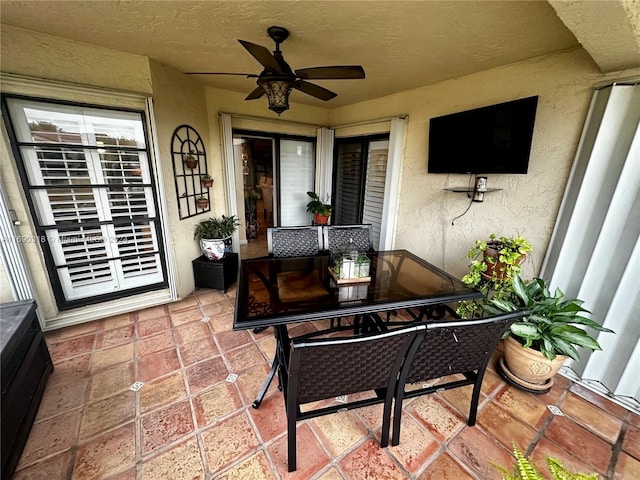 view of patio featuring ceiling fan