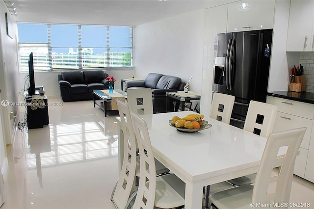 dining area with light tile patterned floors