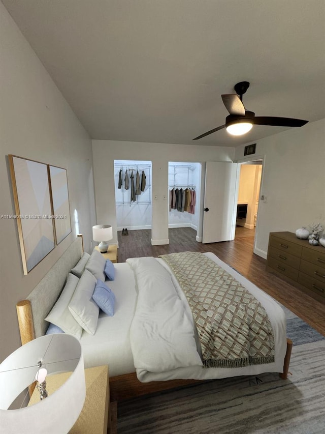 bedroom with dark wood-type flooring and ceiling fan