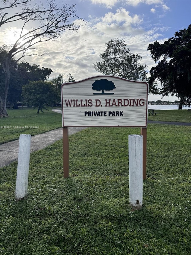 community / neighborhood sign with a lawn