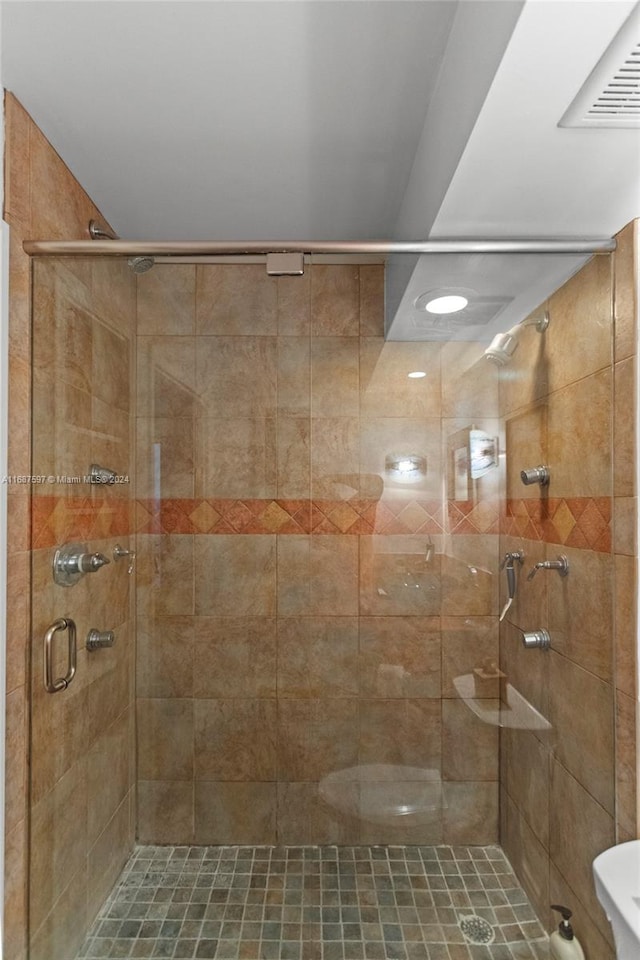 bathroom with an enclosed shower