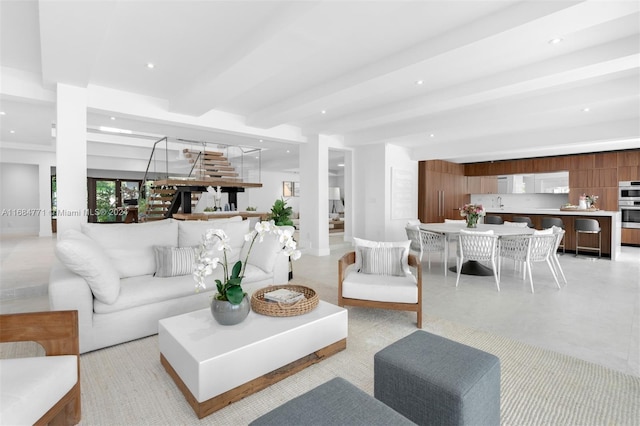 living room featuring beam ceiling