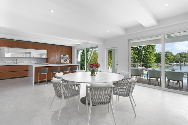 dining room featuring beam ceiling