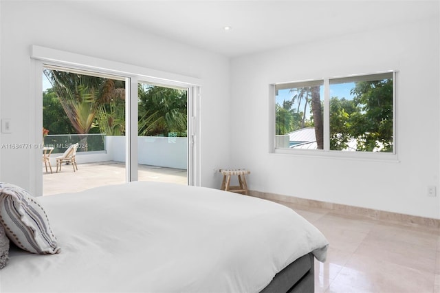 tiled bedroom featuring access to exterior and multiple windows