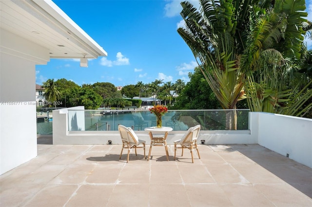 view of patio featuring a water view