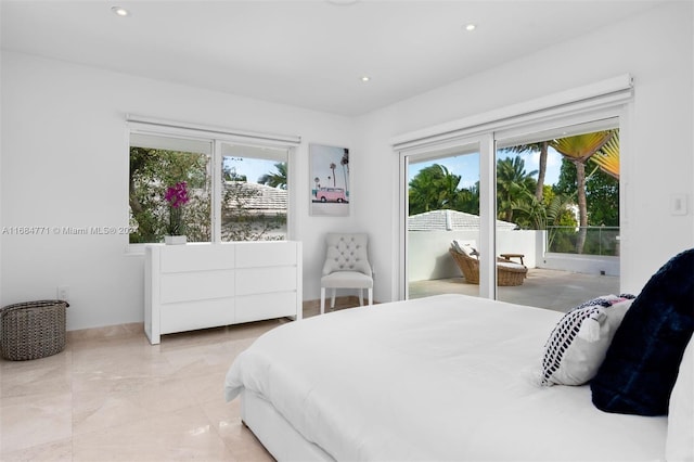 bedroom featuring access to outside and multiple windows