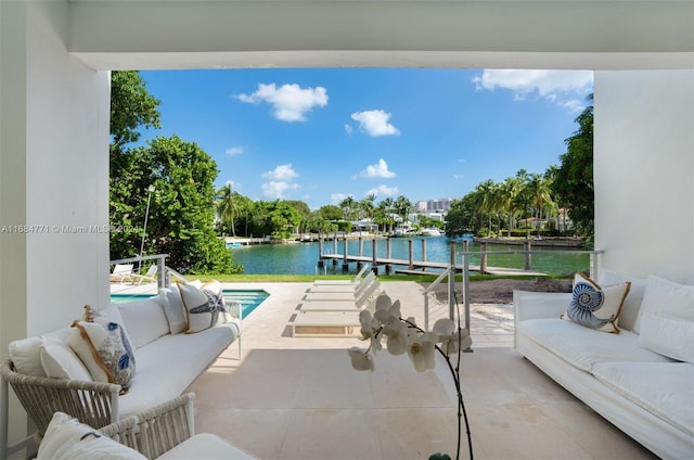 view of patio / terrace featuring outdoor lounge area and a water view