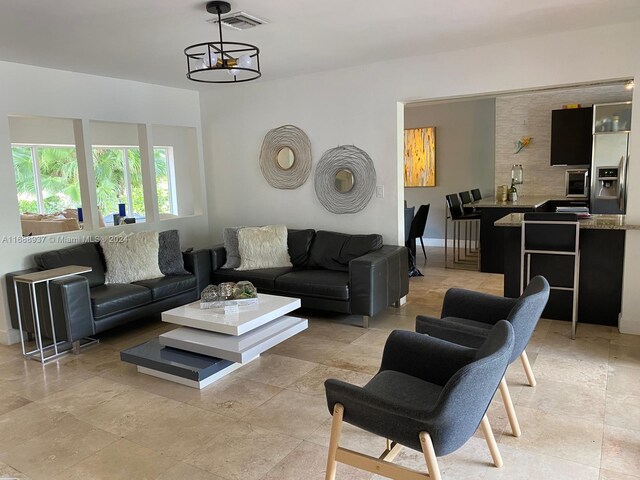 living room featuring an inviting chandelier