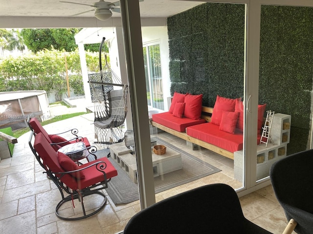 view of patio / terrace with an outdoor living space and ceiling fan