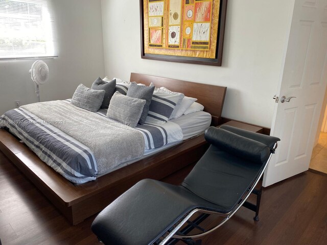 bedroom featuring dark wood-type flooring