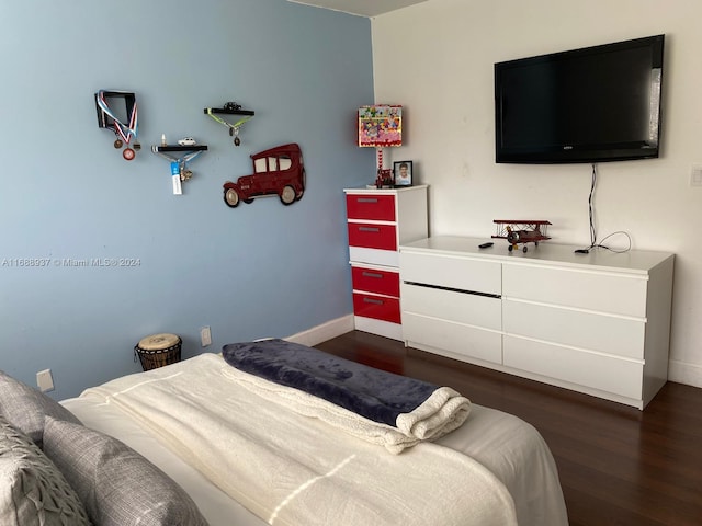 bedroom featuring dark wood-type flooring