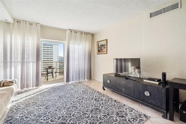 tiled living room with a textured ceiling