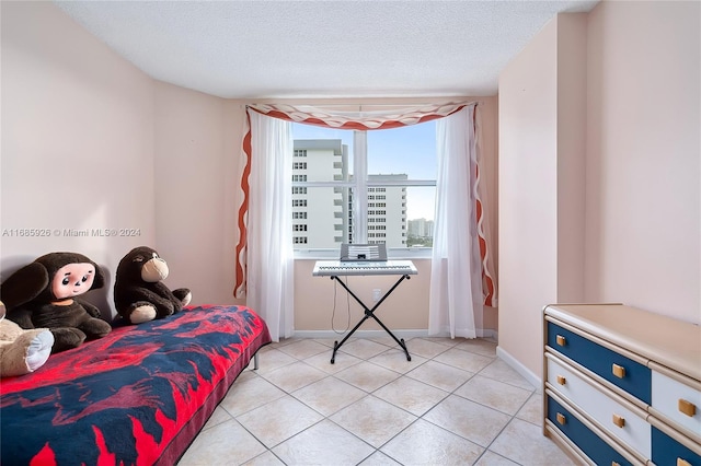 tiled bedroom with a textured ceiling