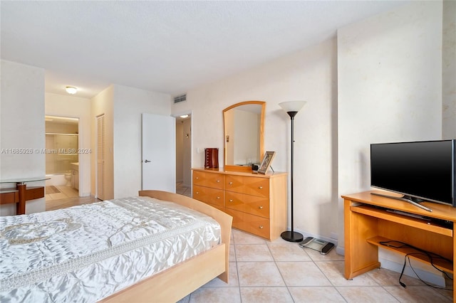 tiled bedroom with ensuite bathroom