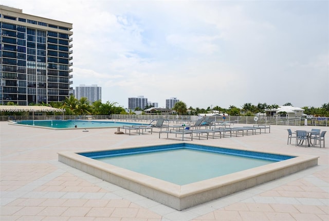 view of swimming pool with a patio