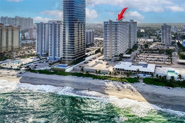 property's view of city featuring a view of the beach and a water view