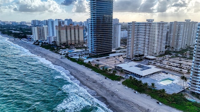 bird's eye view with a beach view and a water view