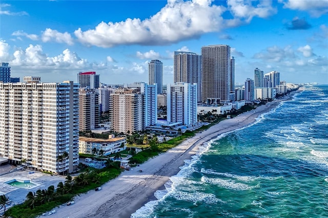 view of city featuring a view of the beach and a water view