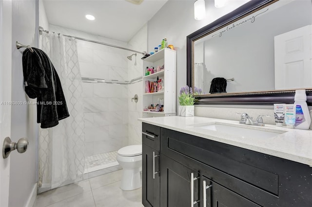 bathroom featuring tile patterned flooring, a shower with curtain, vanity, and toilet