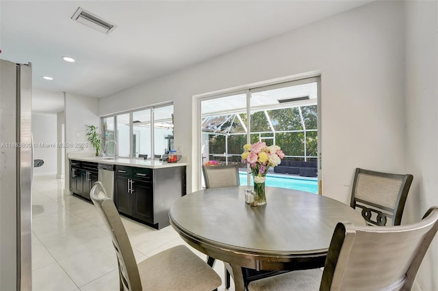 tiled dining area with sink