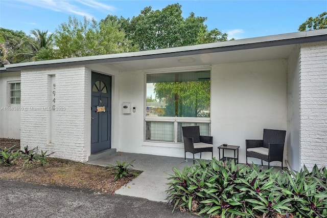 doorway to property featuring covered porch