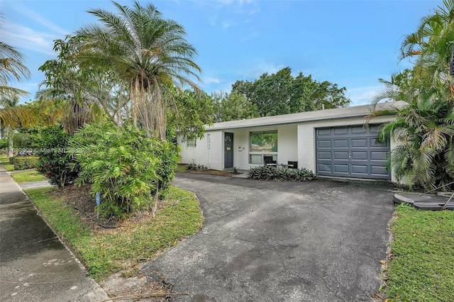 single story home with a garage