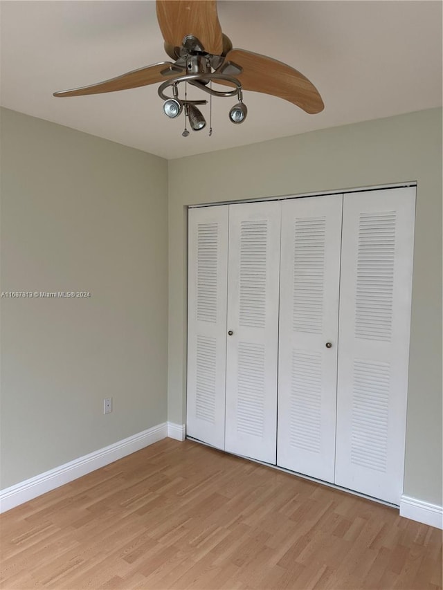 unfurnished bedroom featuring a closet, ceiling fan, and light hardwood / wood-style flooring