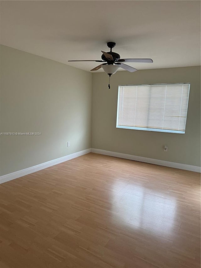 empty room featuring light hardwood / wood-style flooring and ceiling fan