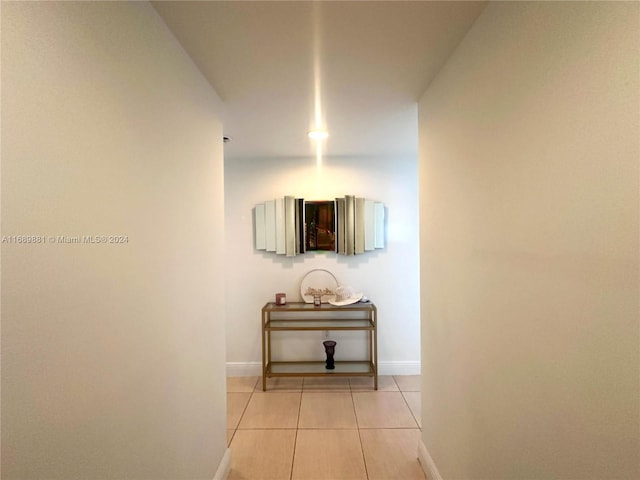 hallway featuring light tile patterned floors