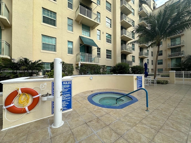 view of pool featuring a hot tub