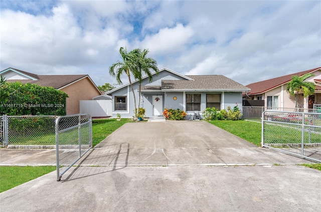 ranch-style home with a front lawn