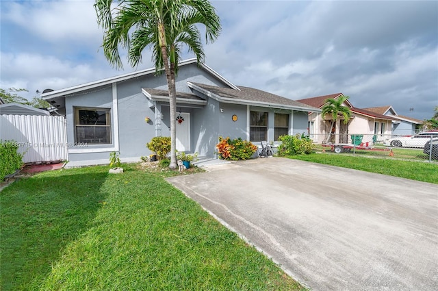 ranch-style house with a front lawn